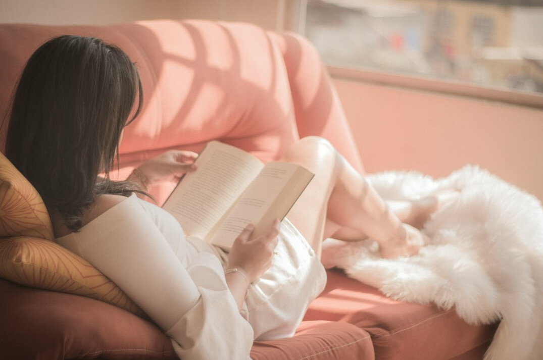 woman reading mystery book