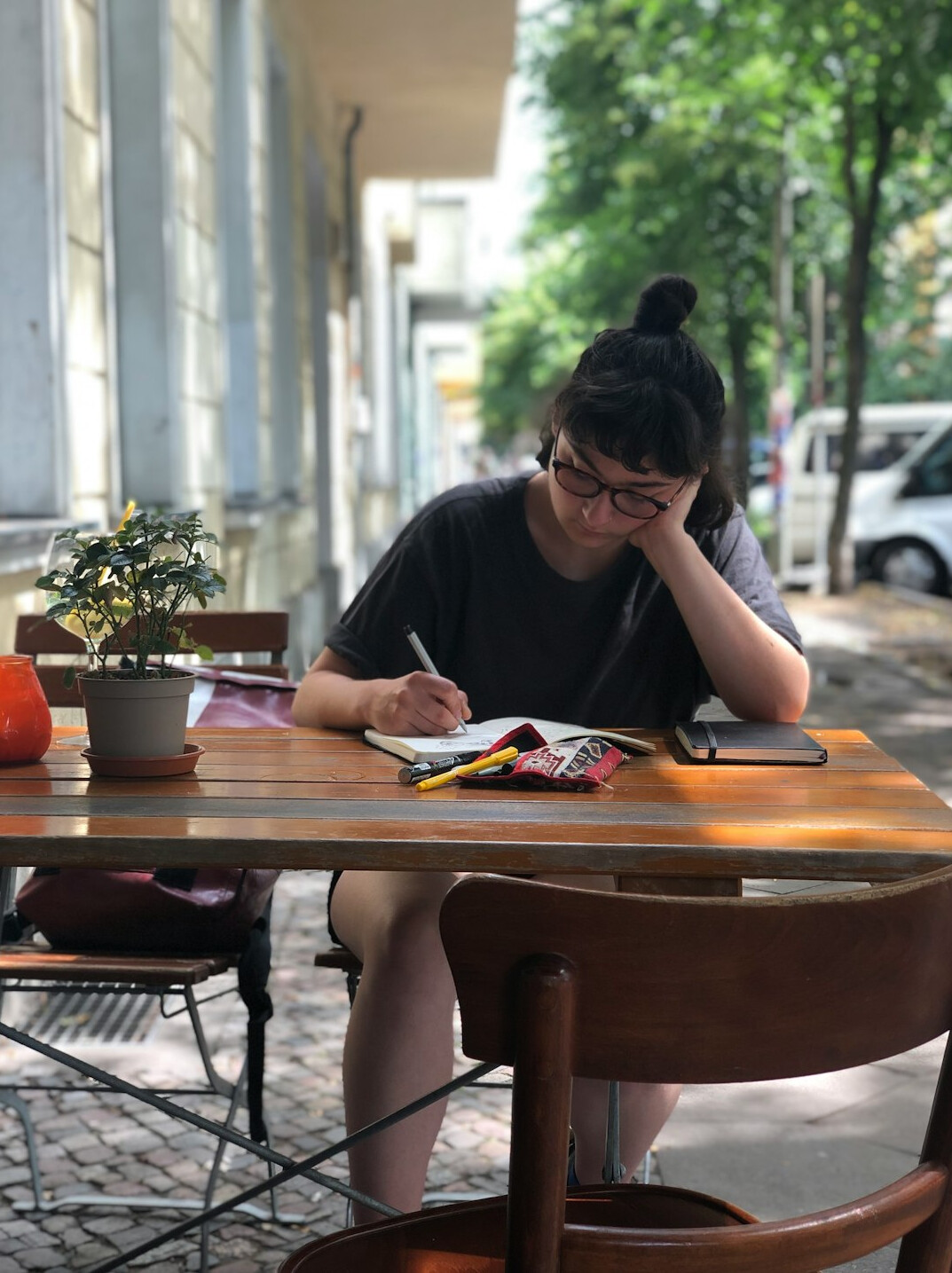 writer at desk with book