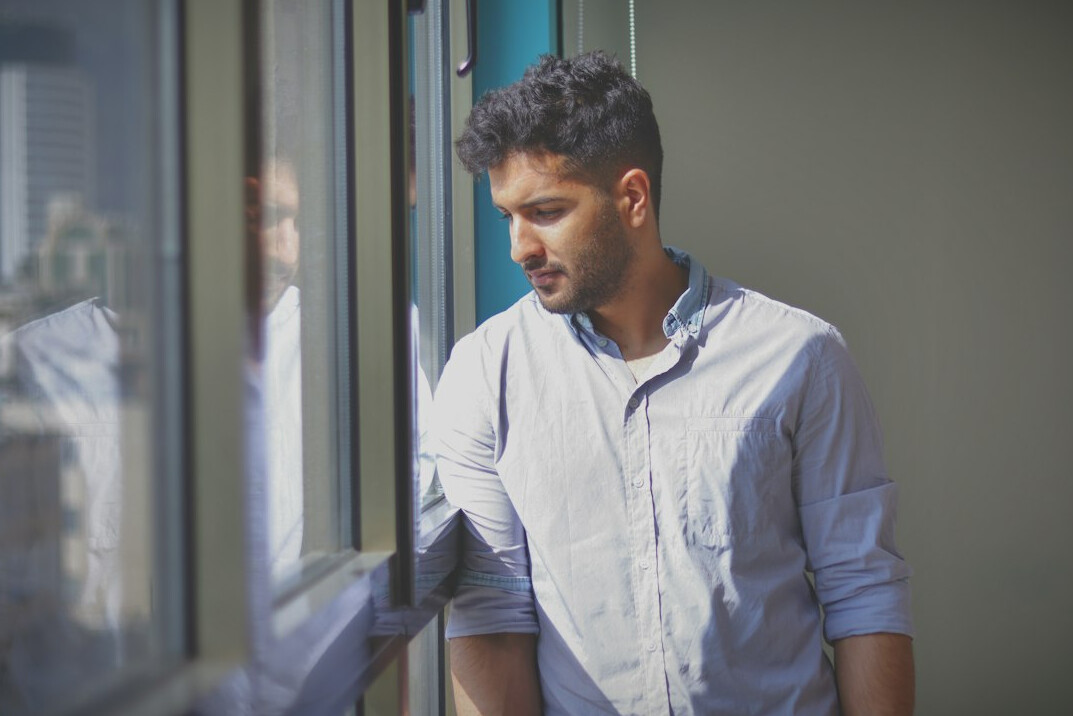 man thinking at window